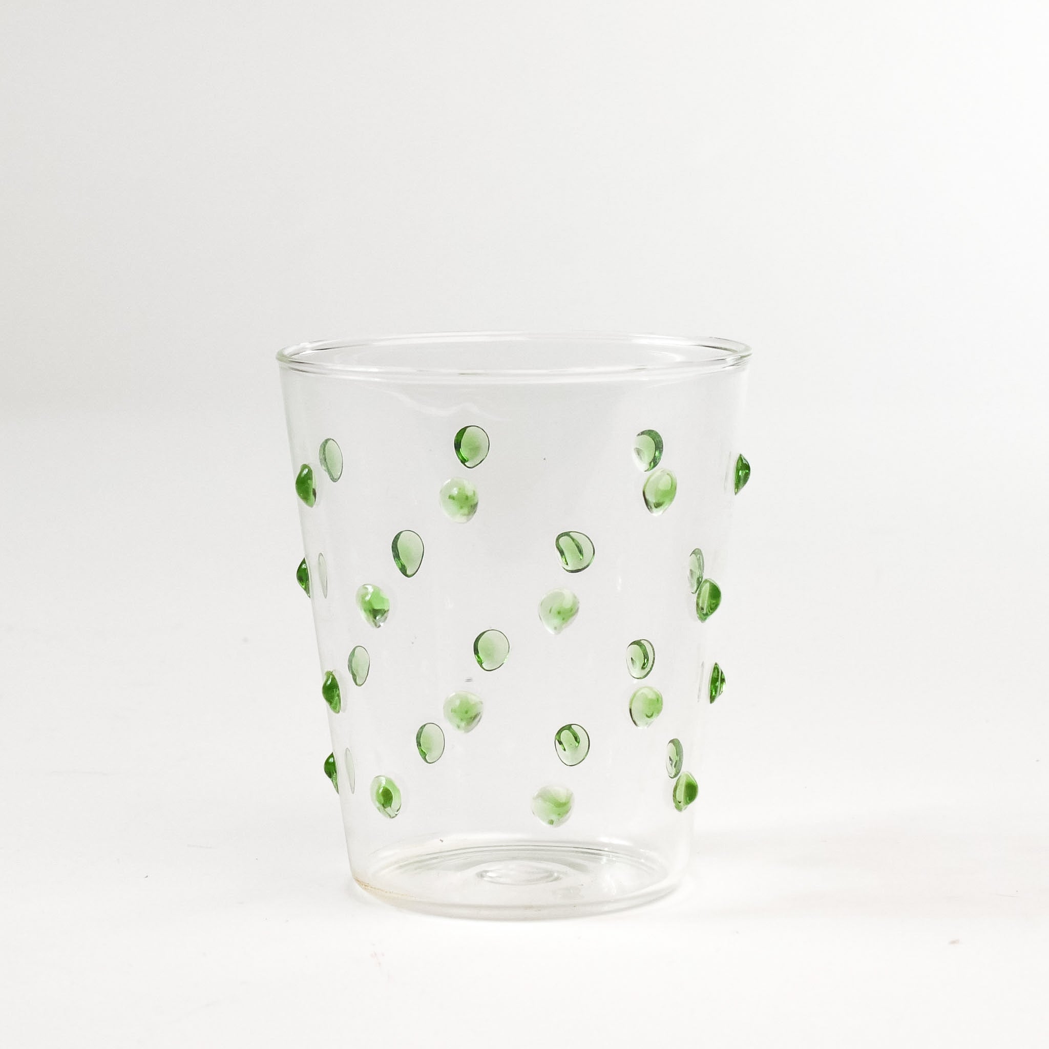 three-dimensional drinking glasses with green colored raised dots