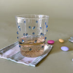 three-dimensional drinking glasses with blue colored raised dots