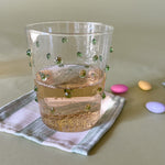 three-dimensional drinking glasses with green colored raised dots