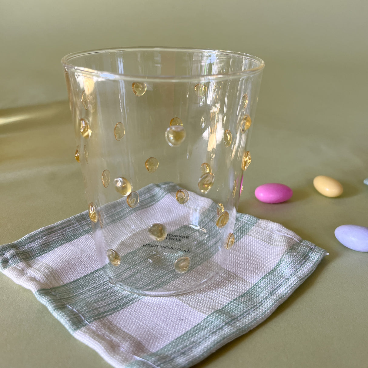 three-dimensional drinking glasses with yellow colored raised dots