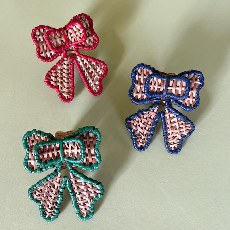 three rattan bow napkin rings