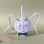 white rattan bunny easter basket with egg in it