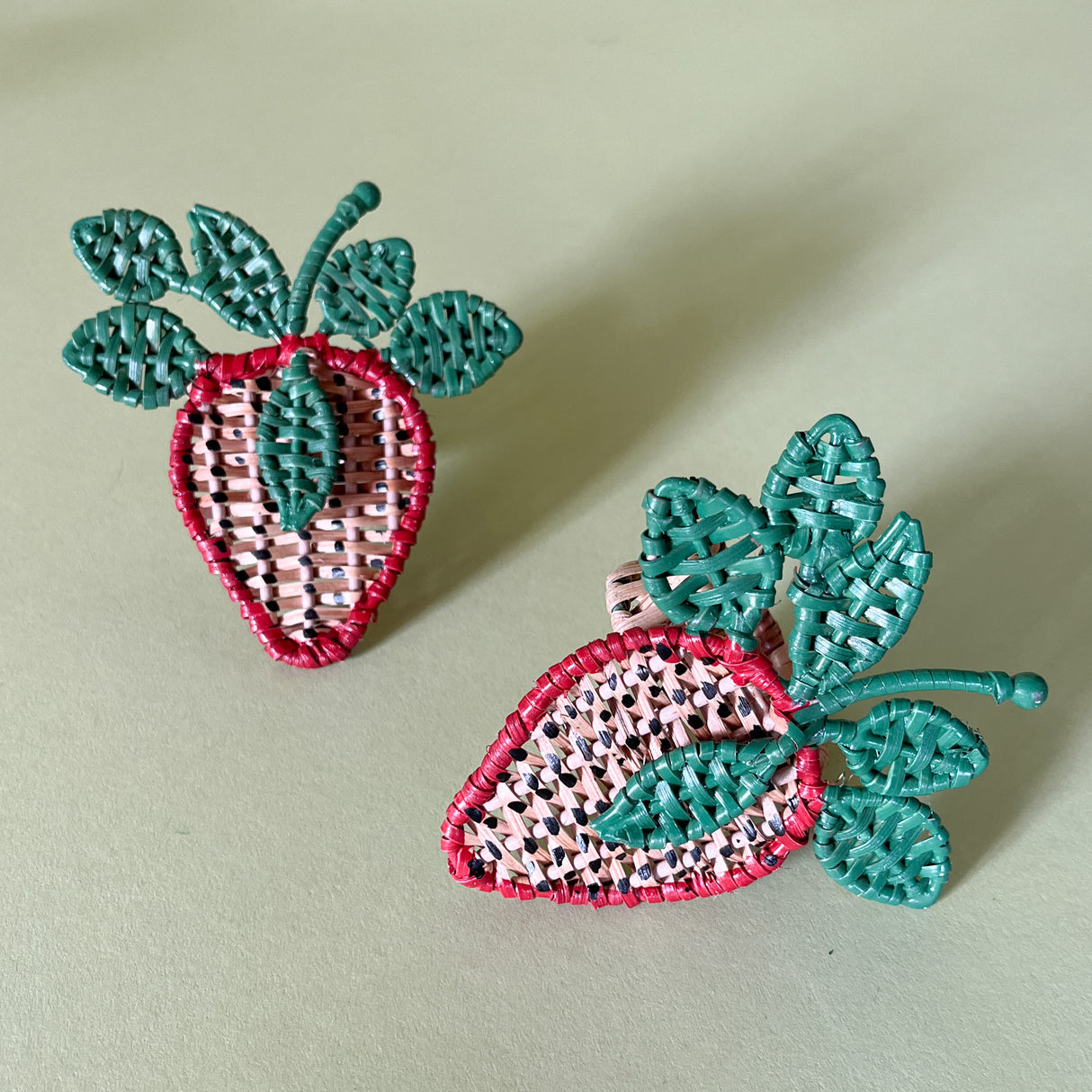 pair of strawberry shaped rattan napkin rings