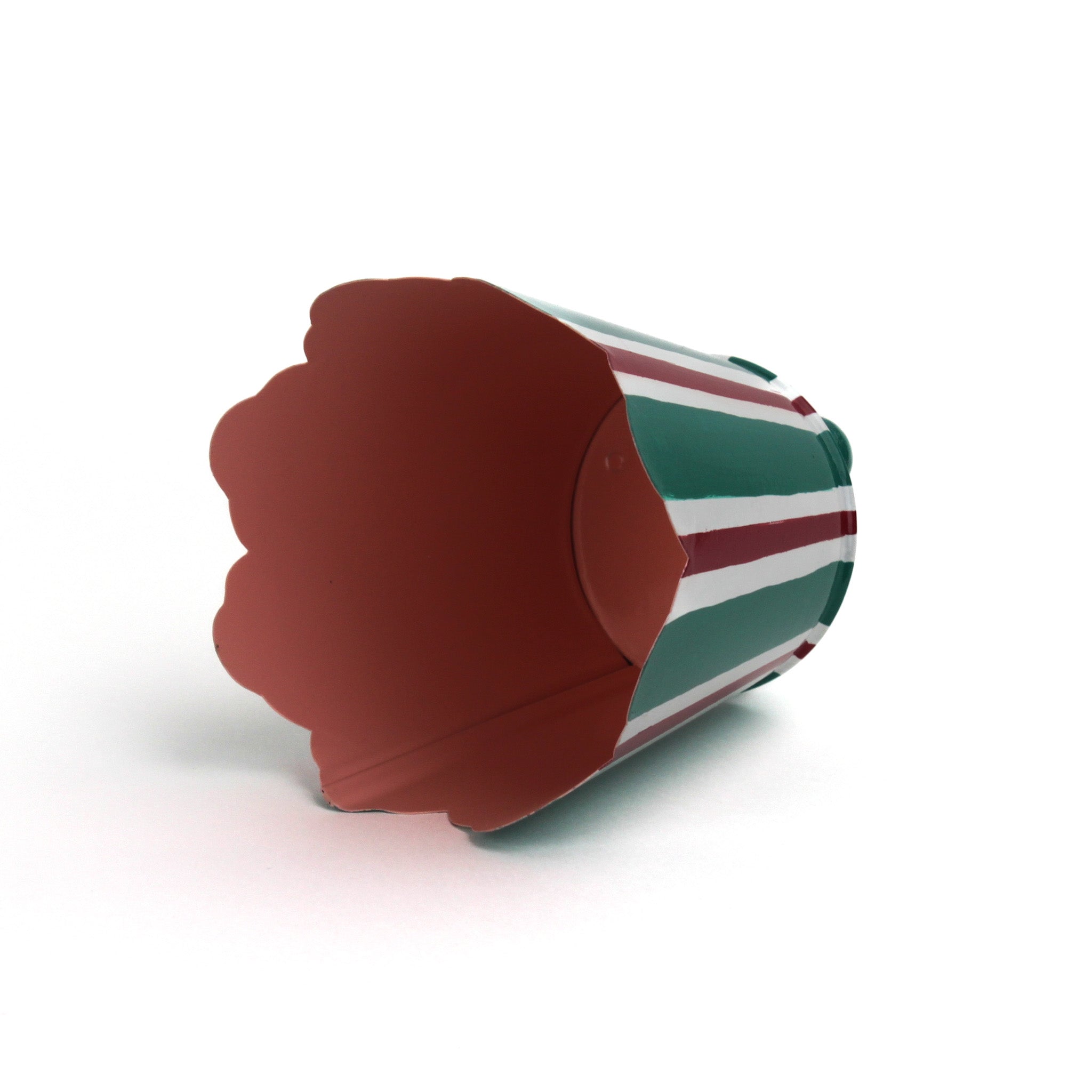 Red and green striped tole cachepot shown on its side to display the solid red interior.