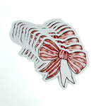 Red and white striped bow paper place card on a white background