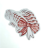 Red and white striped bow paper place card on a white background