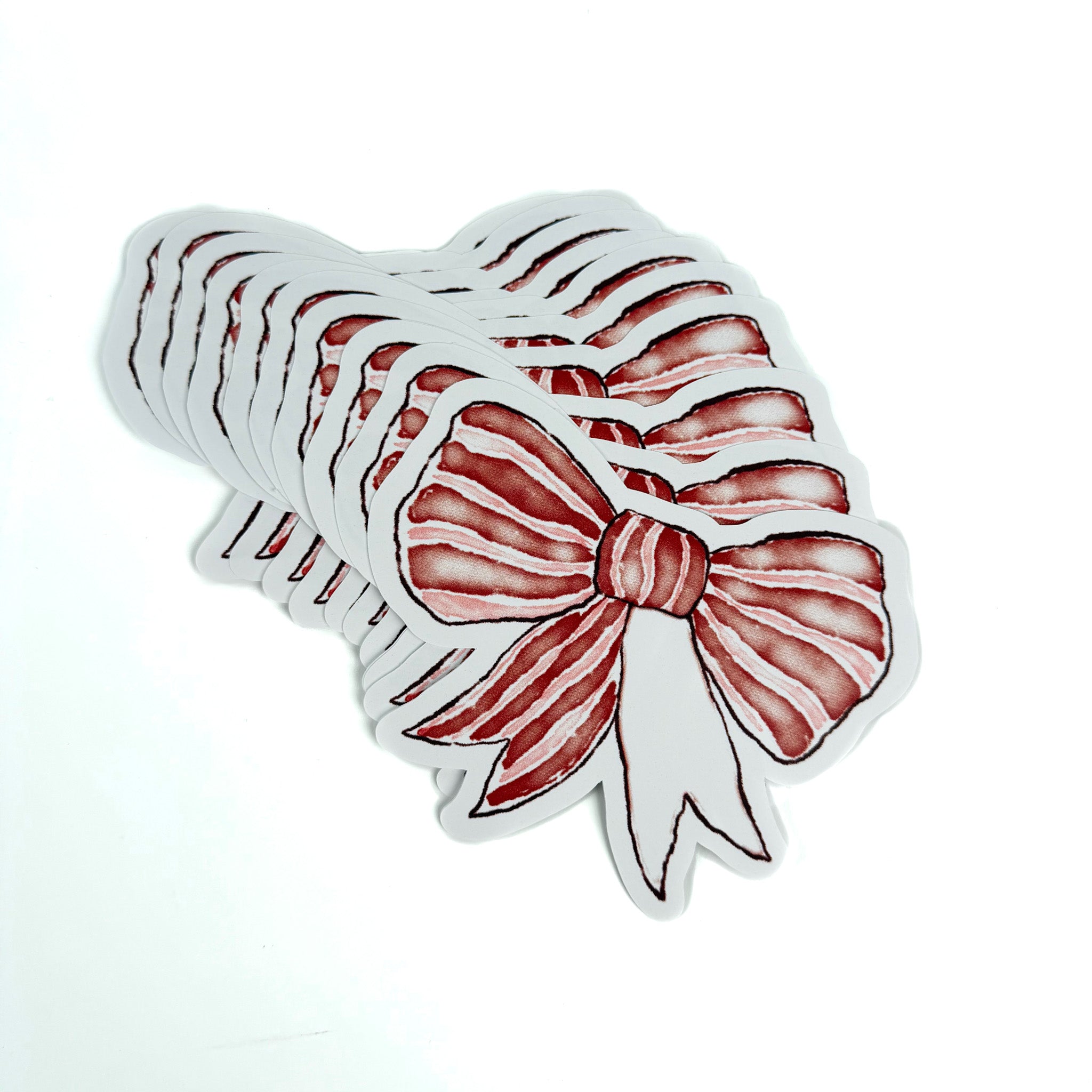 Red and white striped bow paper place card on a white background