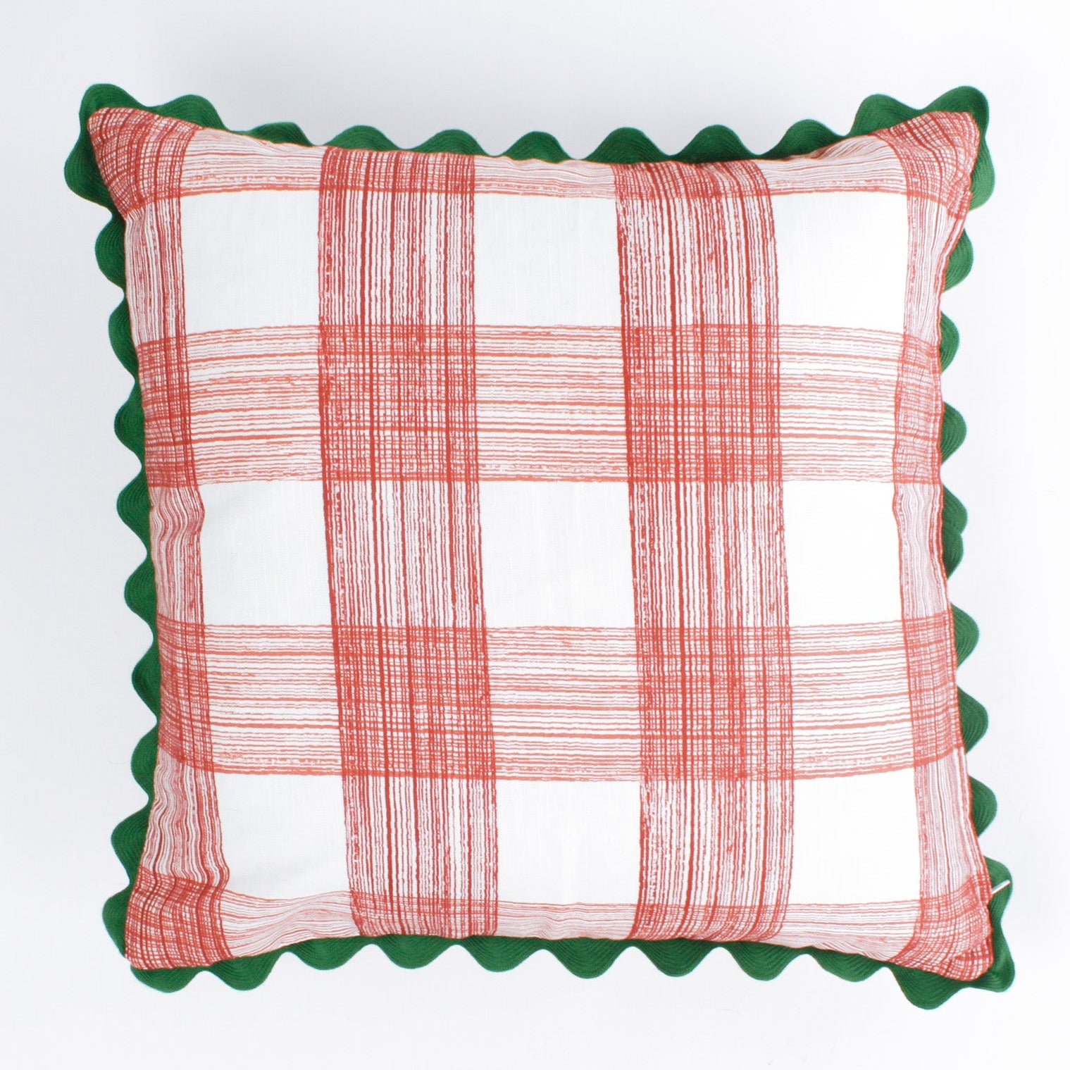 Square decorative pillow with a red gingham plaid pattern on a white background, accented with a dark green scalloped trim around the edges.