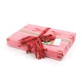 side angle of a Pink wrapping paper roll with a festive pattern featuring lobsters, bows, and decorative stripes.