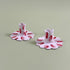 Pair of madcap cottage ceramic candle holders with scalloped edges and a red and pink Club House pattern