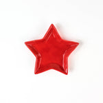 Red star-shaped dish on a white background