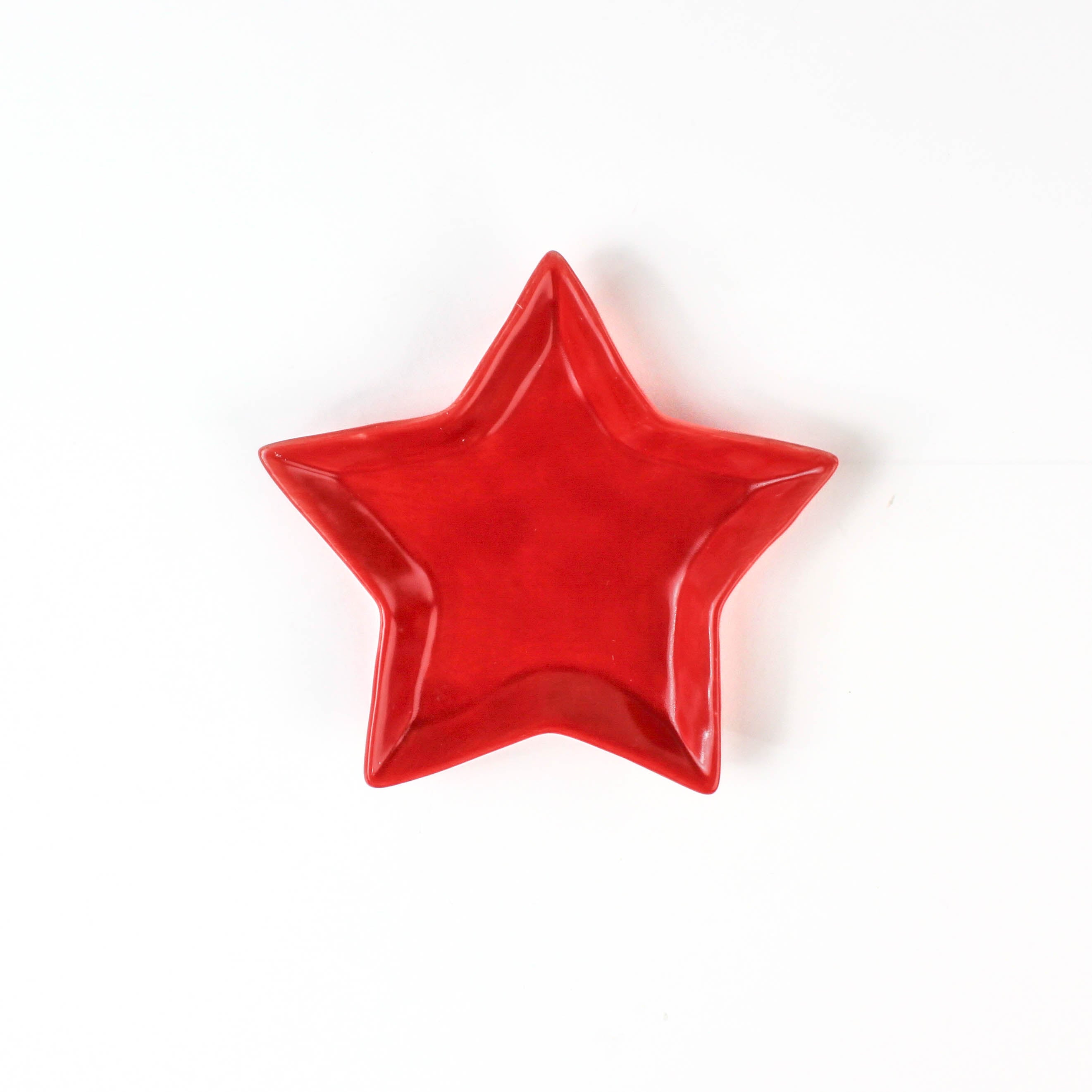 Red star-shaped dish on a white background