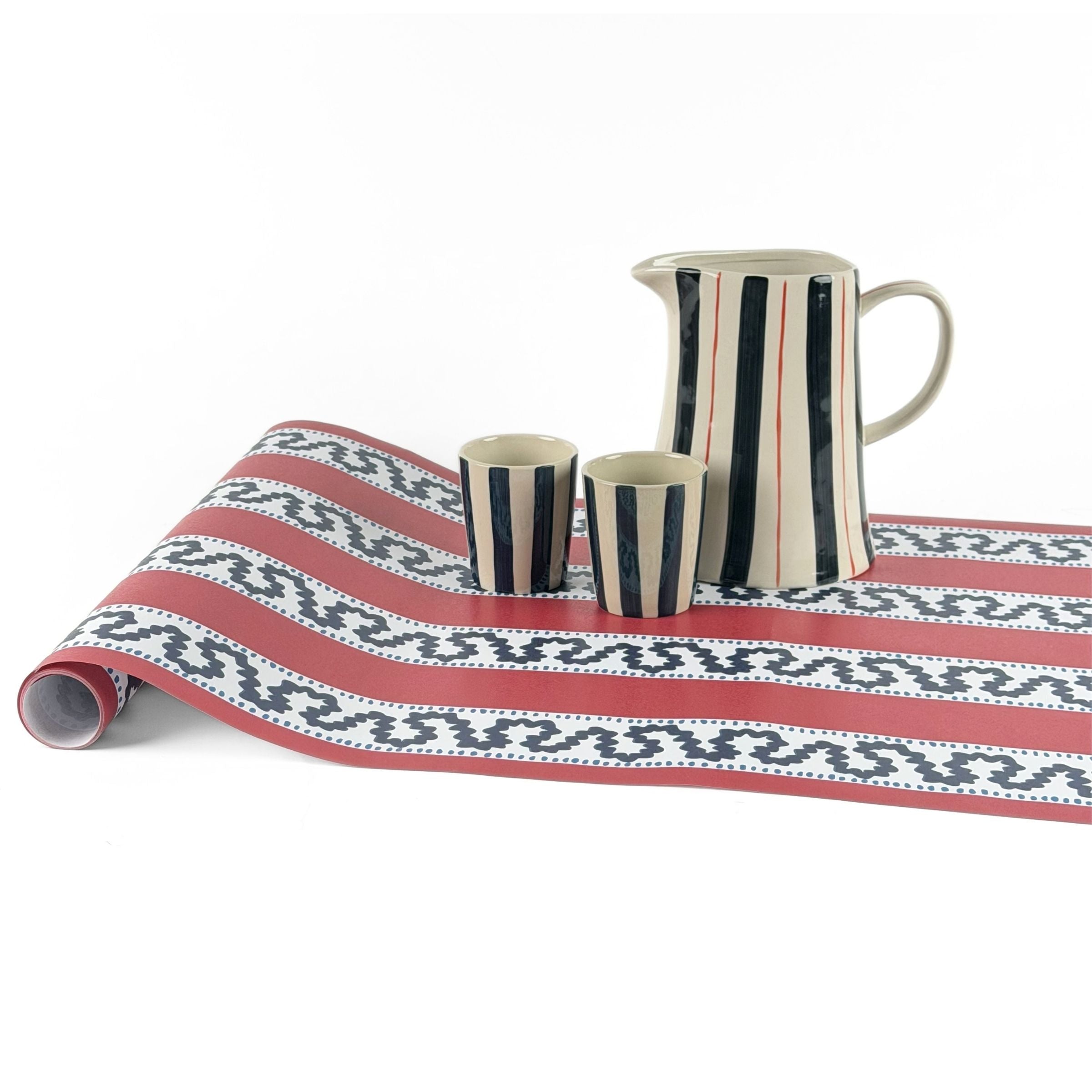Harbor Trail red white and blue striped paper runner styled with striped pitcher and cups.