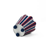 A bottom of a  scalloped top, red white and blue striped cachepot on a white background