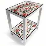 a two tiered white side table painted with red geraniums and dark green edges. 