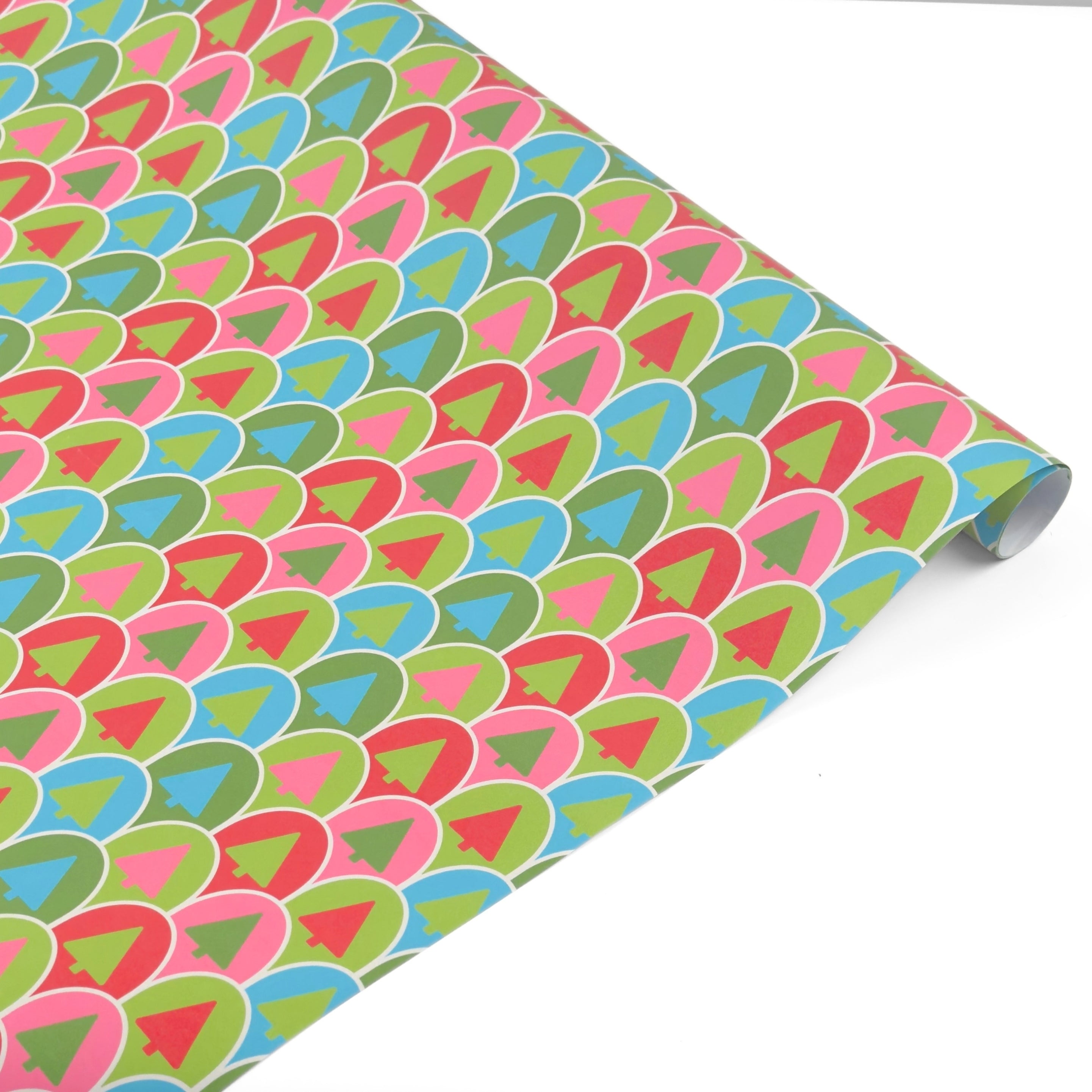 Colorful Christmas gift wrap roll featuring playful retro trees in vibrant pink, green, and blue.