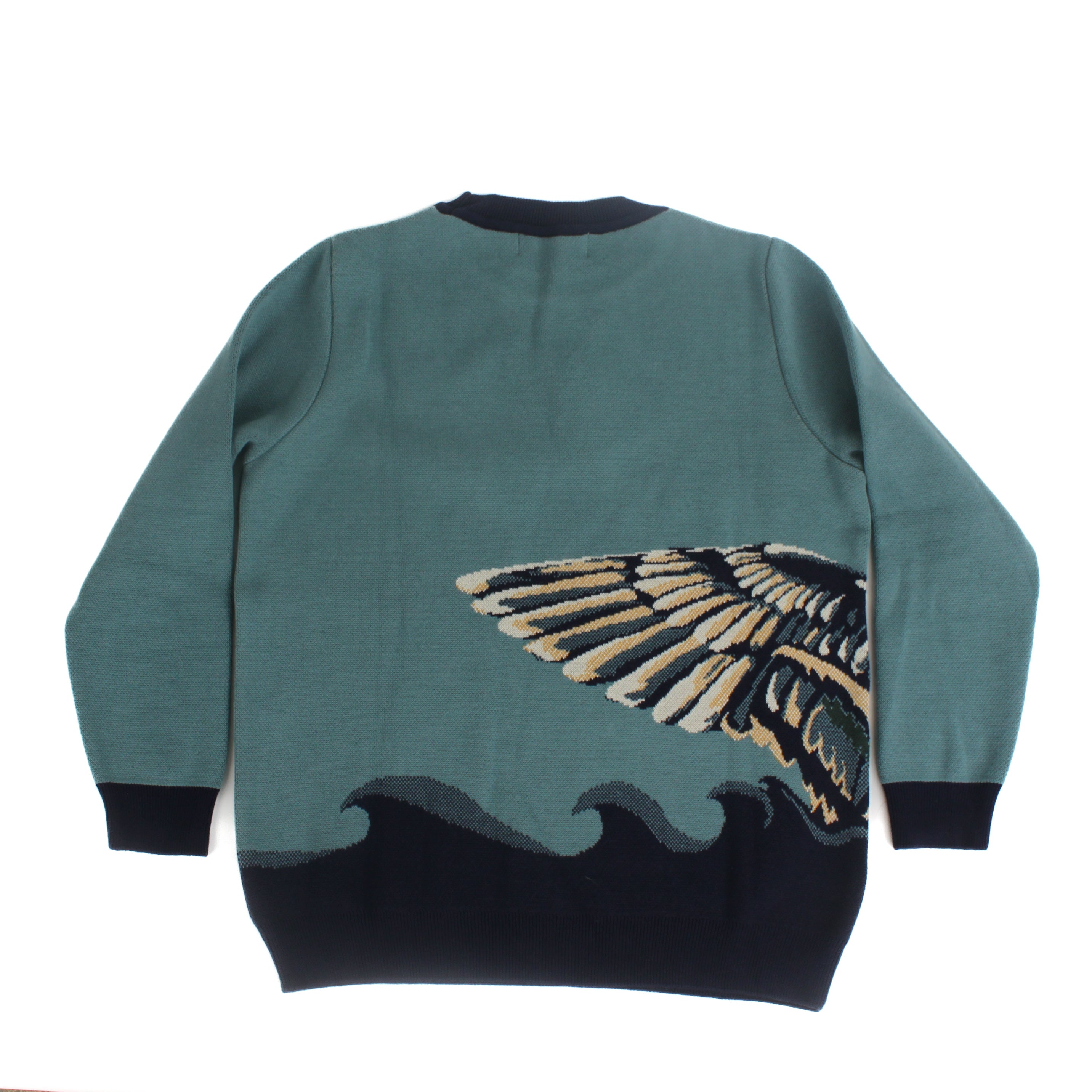 Back view of teal knit sweater featuring a mallard duck wing detail wrapping across the side