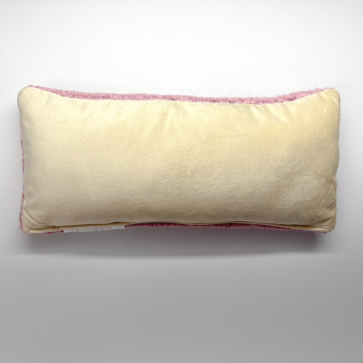 A pink wool lumbar halloween accent pillow with black bat design back view