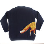 Back view of navy blue knit sweater featuring a fox tail motif wrapping around the side