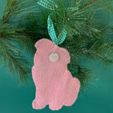 back of a felt Christmas ornament featuring a cute pug with a bright green bow tie and green gingham ribbon