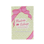 Reverse side of place card packaging with a pink bow, a green repeating star pattern and pink 'Madcap Cottage' text on a white background
