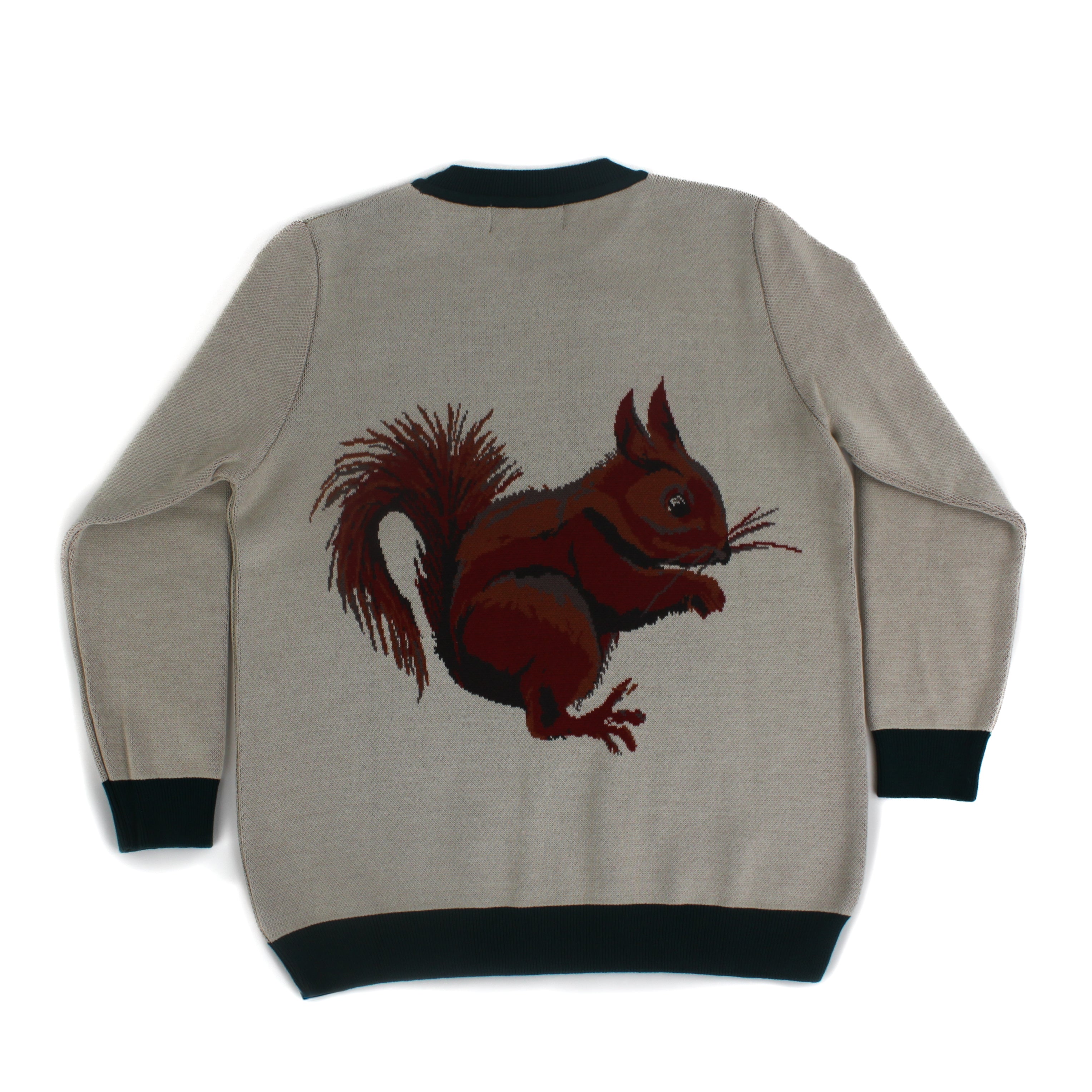 Back view of neutral knit sweater featuring a detailed squirrel motif