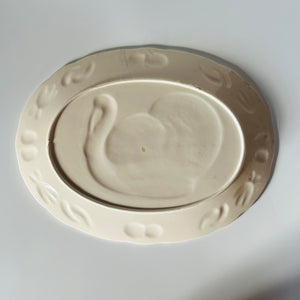 the plain white reverse side of a vintage turkey platter