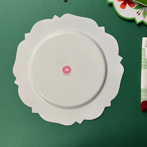 the reverse side of a metal geranium plate hand-painted with geraniums and green trim
