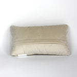 the reverse side of a white pickleball pillow with red paddles from madcap cottage