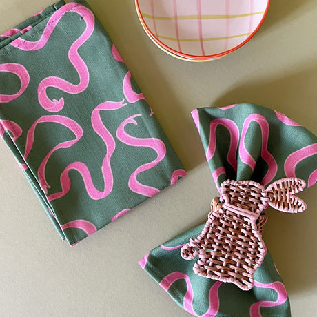 pink and green dinner napkin in ribbon print fabric from madcap cottage with bunny napkin ring