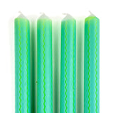 Green and blue ricrac stripe taper candles set with decorative wavy pattern for spring table decor.