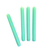 Green and blue ricrac stripe taper candles set with decorative wavy pattern for spring table decor.