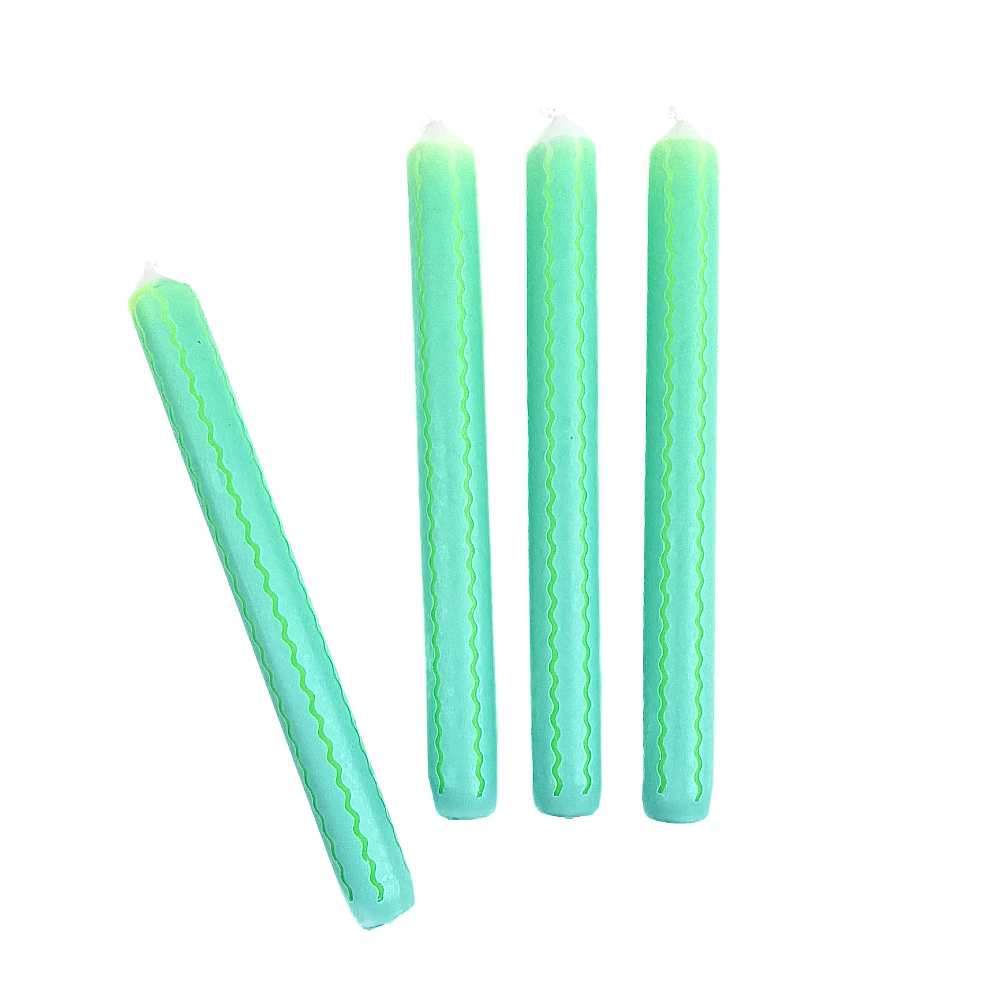 Green and blue ricrac stripe taper candles set with decorative wavy pattern for spring table decor.