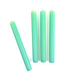 Green and blue ricrac stripe taper candles set with decorative wavy pattern for spring table decor.