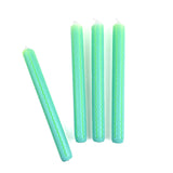 Green and blue ricrac stripe taper candles set with decorative wavy pattern for spring table decor.