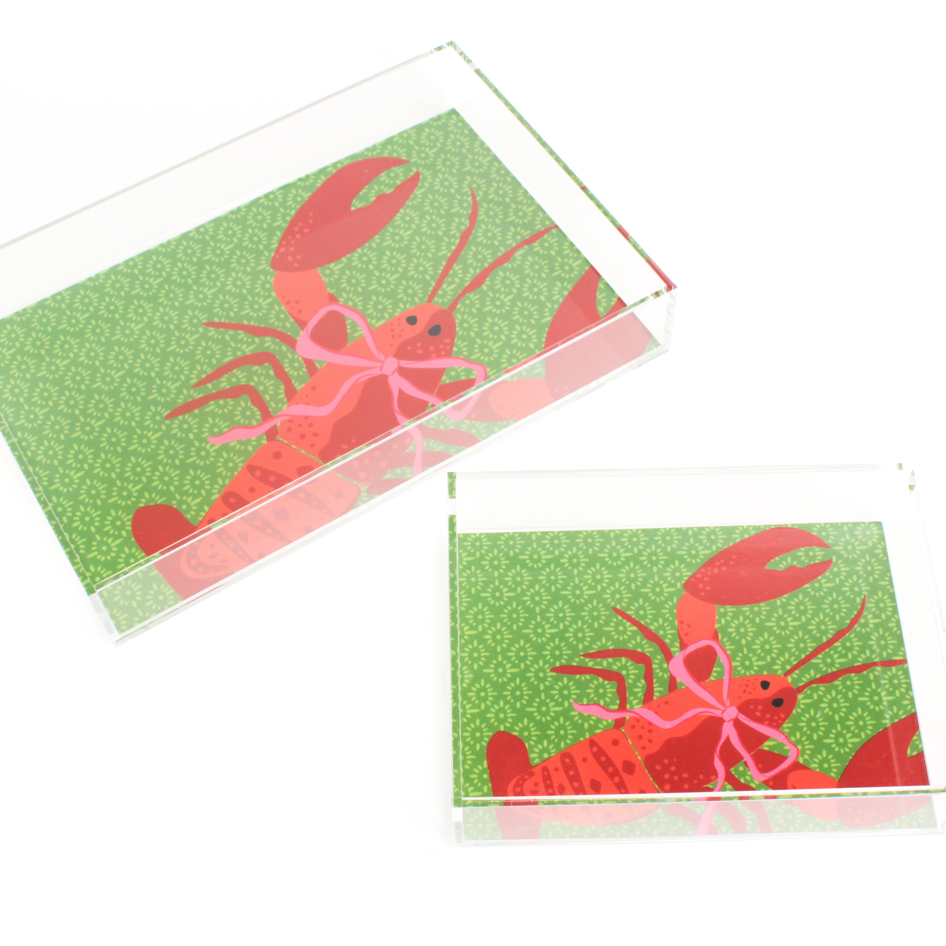 Rock Lobster is a rectangular acrylic tray with a green base and a large orange lobster motif from madcap cottage