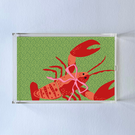 Rock Lobster is a rectangular acrylic tray with a green base and a large orange lobster motif from madcap cottage