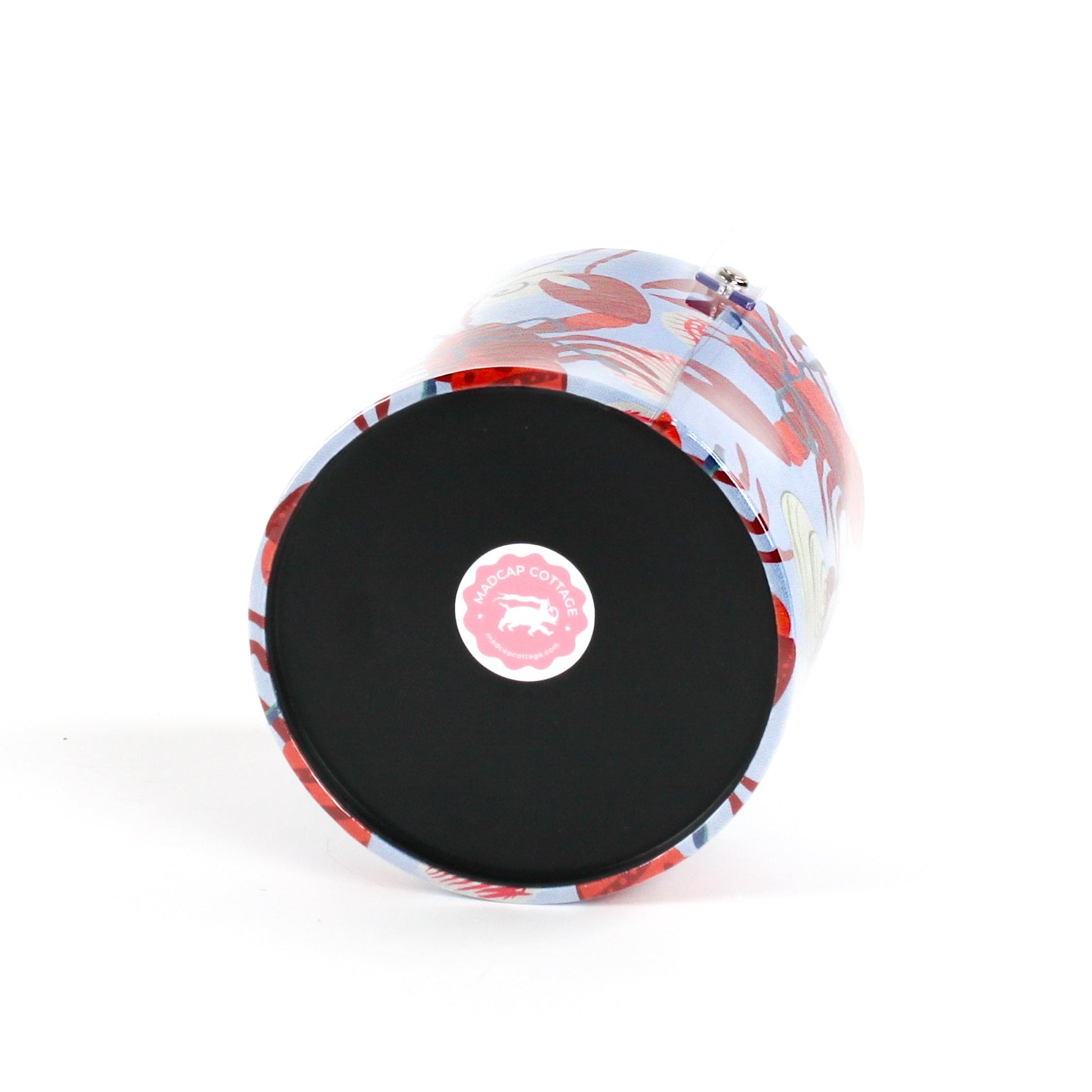 bottom of a Rock Lobster red and blue ice bucket filled with ice and champagne features a green shell and red lobster print