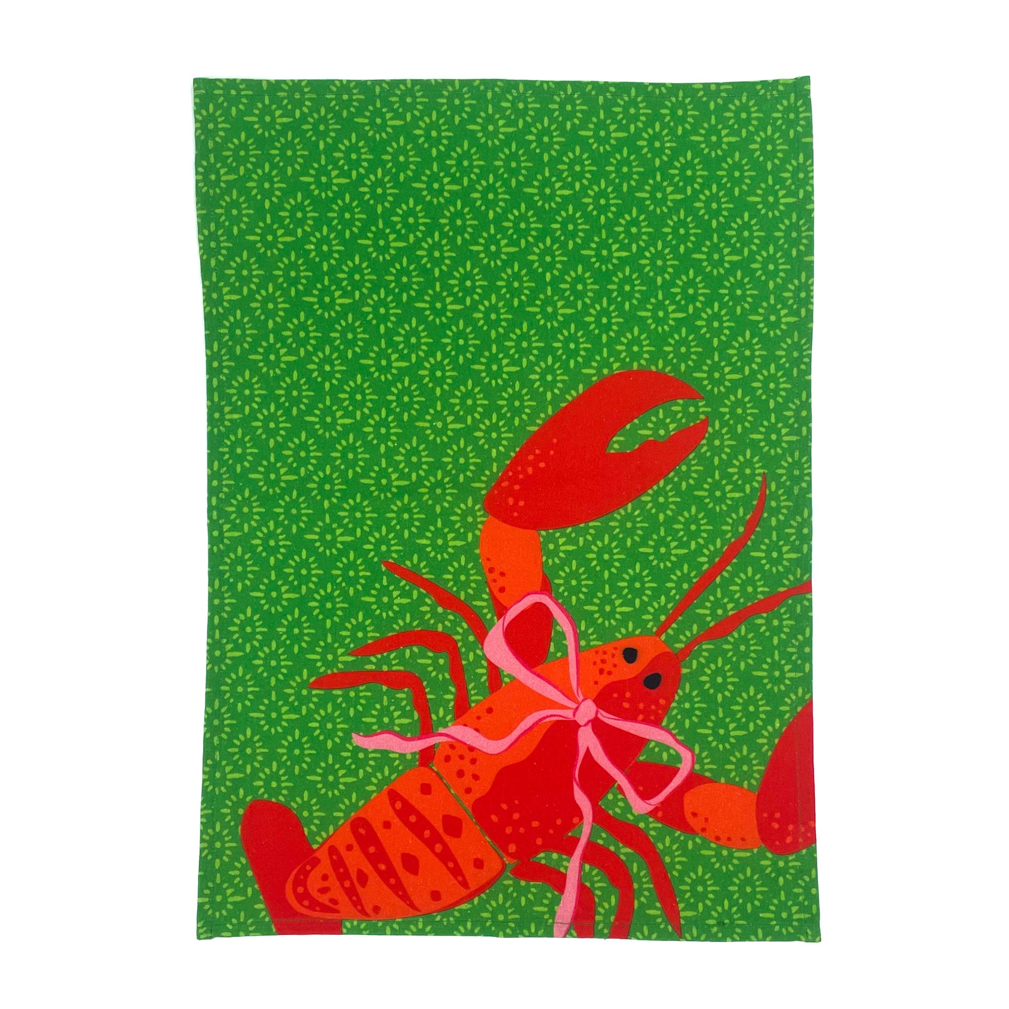 a green block print design and a big red lobster tea towel against a white background. 