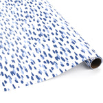 Roll of blue brushstroke wrapping paper on a white background.