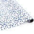 Roll of blue brushstroke wrapping paper on a white background.