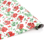 Roll of red geranium floral wrapping paper on a white background.