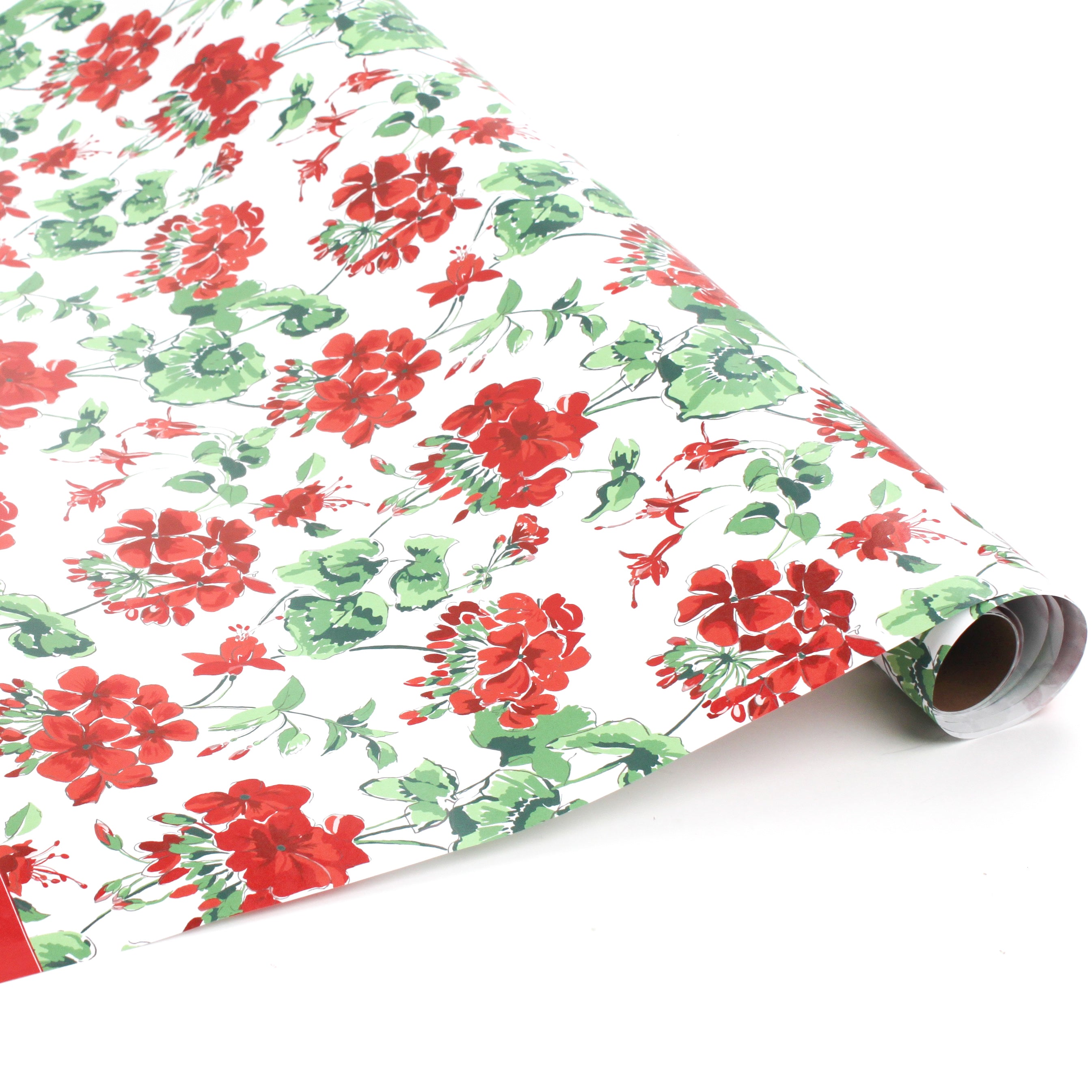 Roll of red geranium floral wrapping paper on a white background.