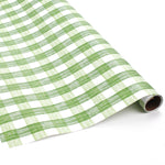 Green gingham Christmas wrapping paper roll with hand-drawn plaid pattern.