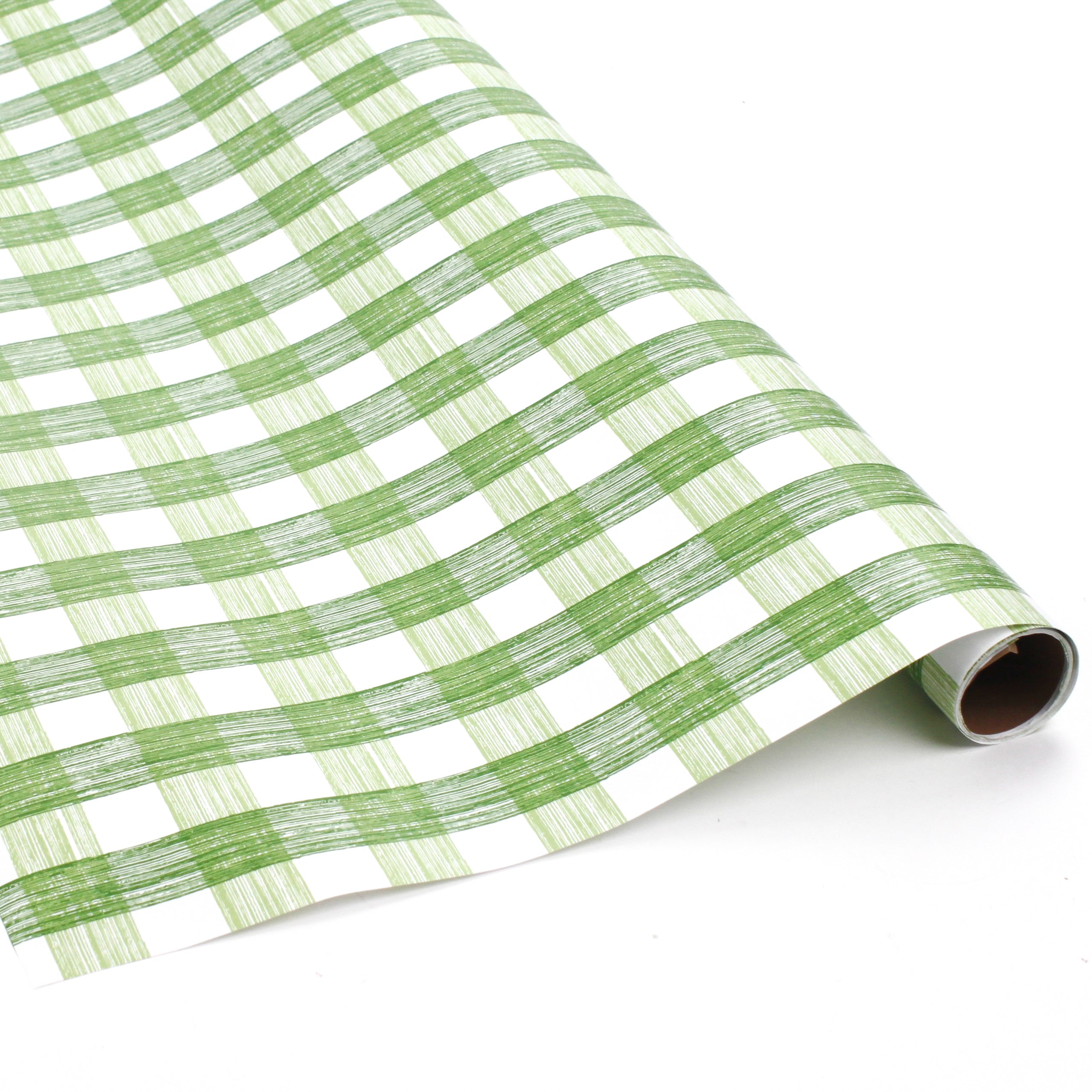 Green gingham Christmas wrapping paper roll with hand-drawn plaid pattern.