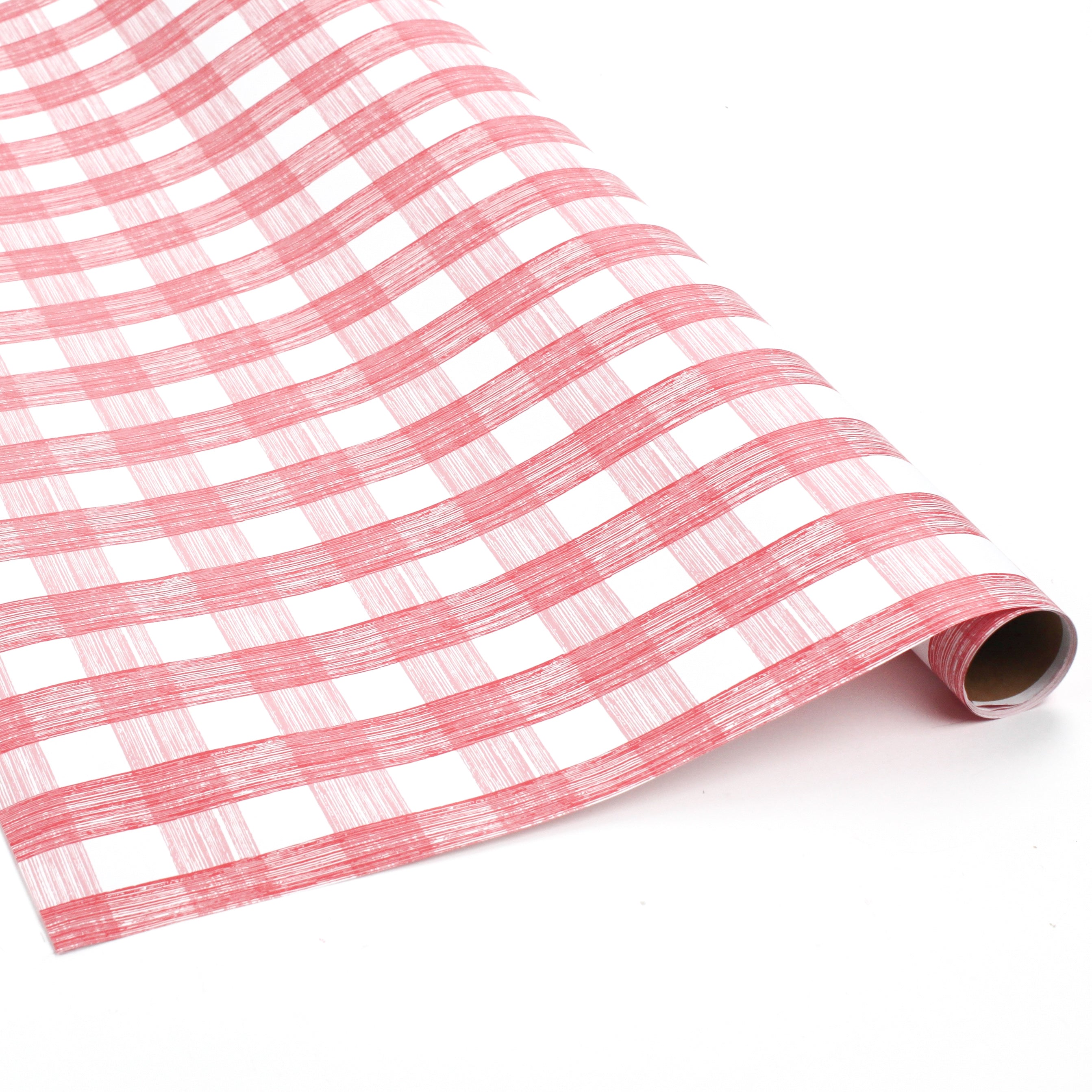 Roll of pink and white gingham wrapping paper with hand-drawn brushstroke pattern.