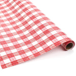 Roll of red and white gingham patterned holiday wrapping paper.