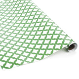 Roll of green wrapping paper with white abstract pattern on a white background.