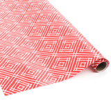 Rolled red gift wrap featuring white geometric square pattern.