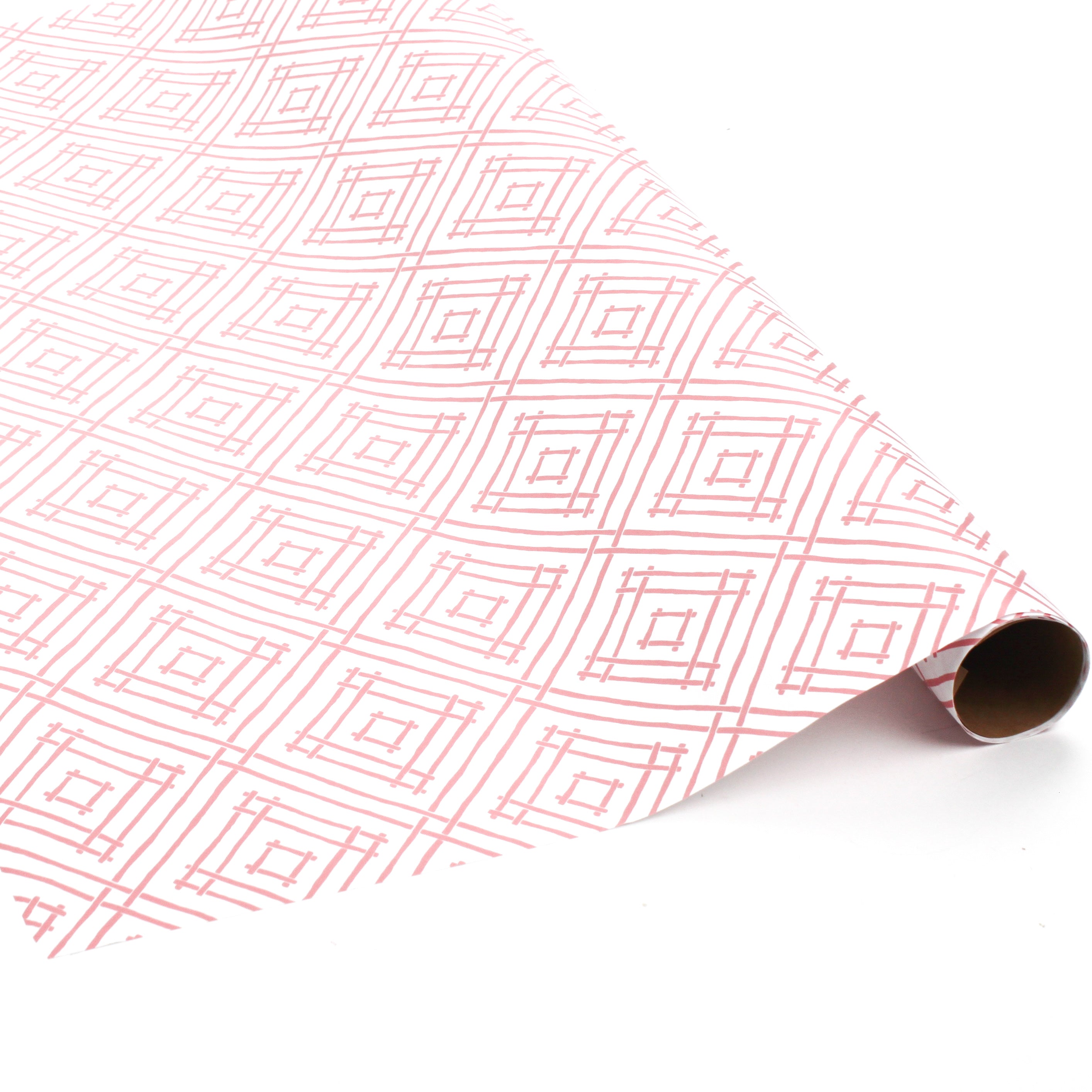 Red and white geometric patterned wrapping paper roll displayed on a white background.
